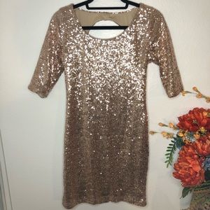 Gold sequin keyhole back quarter length dress.